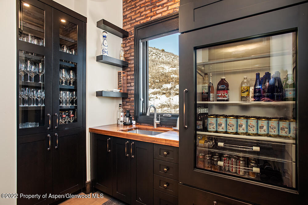 2322 Lazy O Road Snowmass, CO 81654 - Photo 10 of 42 a kitchen with a refrigerator and a stove