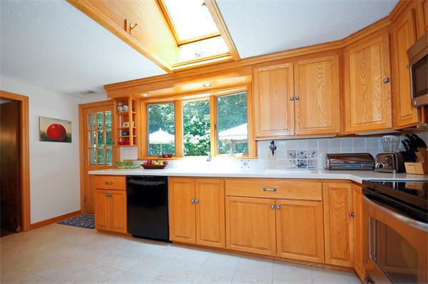 18 Peachtree Road Lexington, MA 02420 - Photo 4 of 22 a kitchen with granite countertop a sink and white cabinets