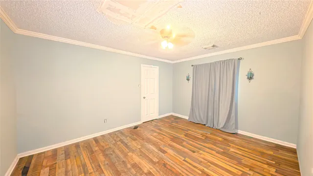 a view of a room with a wooden floor