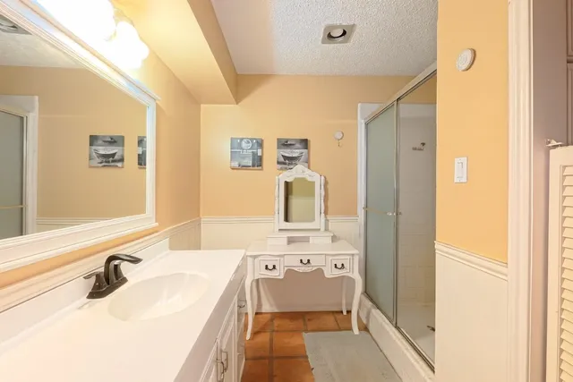 a white toilet sitting next to a window