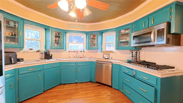 a front view of a house with a yard and trees