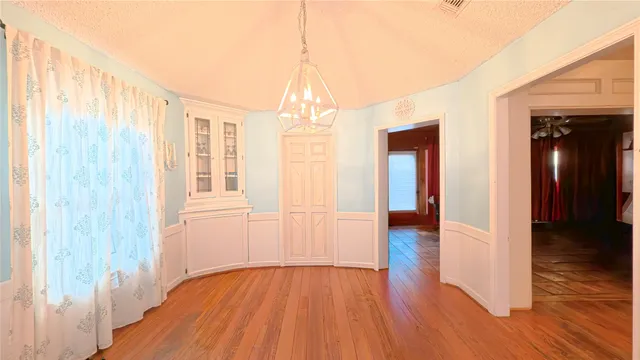 a view of livingroom with hardwood floor and hallway