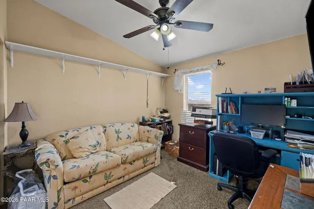 a bedroom with a bed and a chair