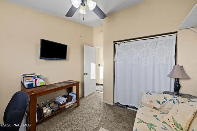 a bedroom with a bed and a tv in it