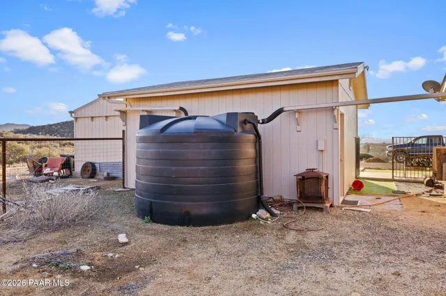a view of a swimming pool with an outdoor seating space