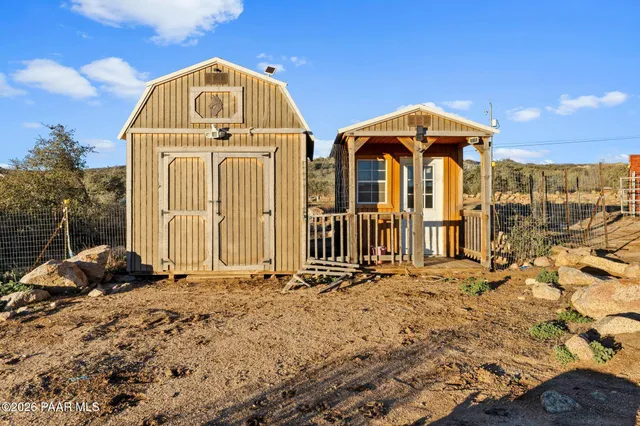 a bedroom with a bed and a mirror