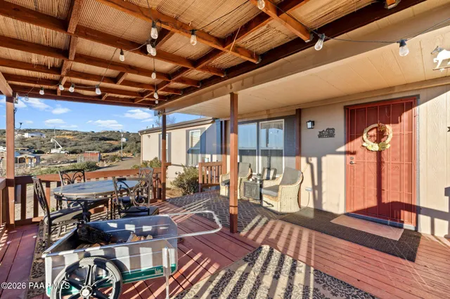 a view of a balcony with wooden floor