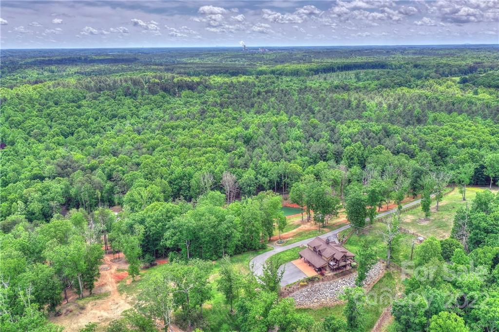 0 Mollys Backbone Road Sherrills Ford, NC 28673 - Photo 3 of 9 an aerial view of residential house with outdoor space and trees all around