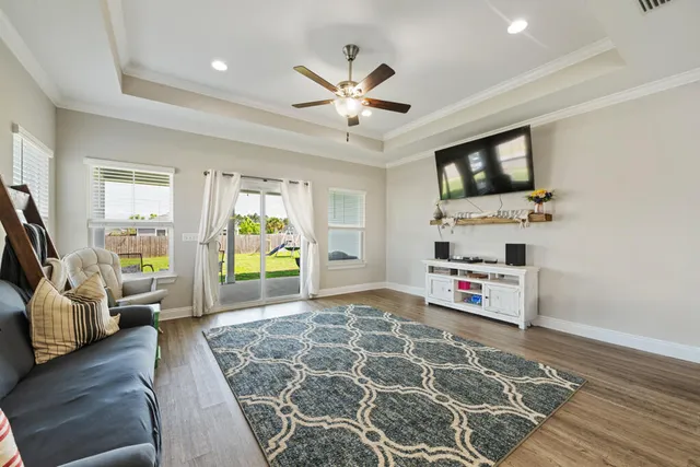 a living room with furniture and a flat screen tv