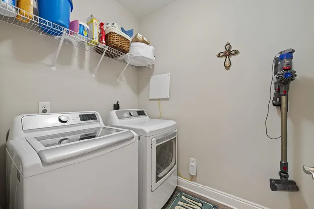 a utility room with dryer and washer