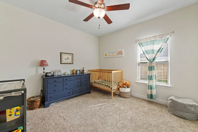 a bed room with furniture and a window