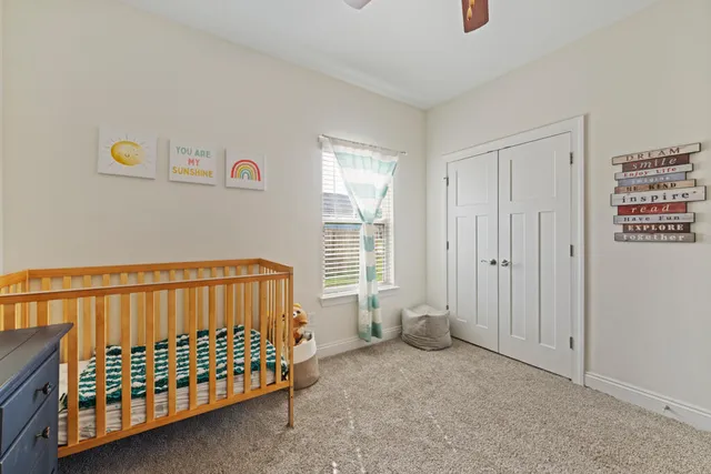 a view of a bedroom with furniture and staircase