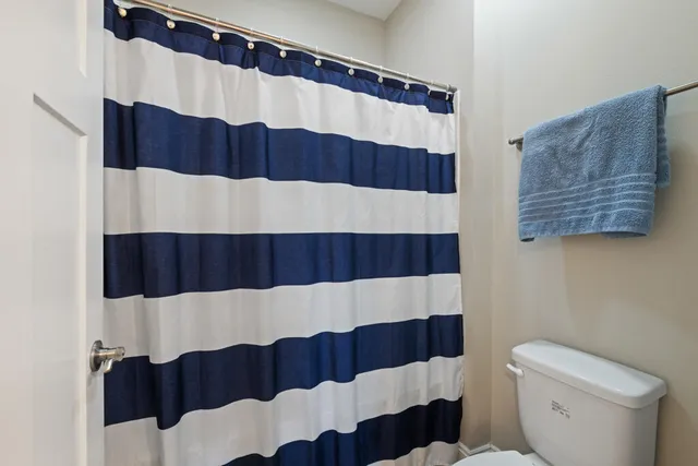 a bathroom with a sink and a curtain