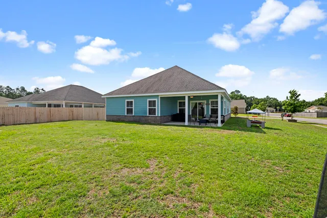 a front view of a house with a garden and porch