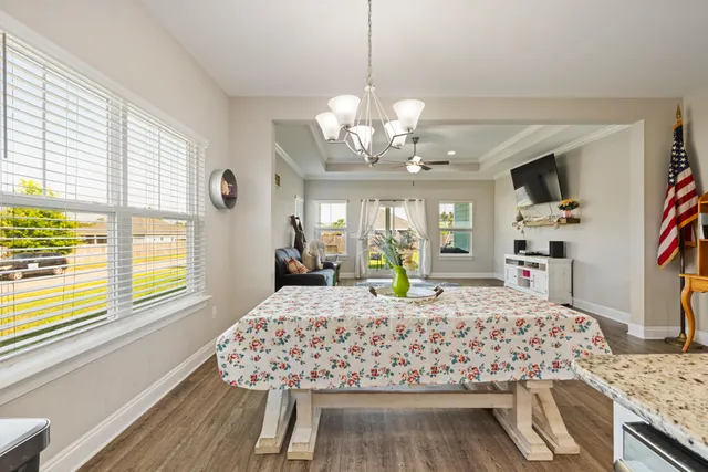 a bed room with a bed mirror and a window