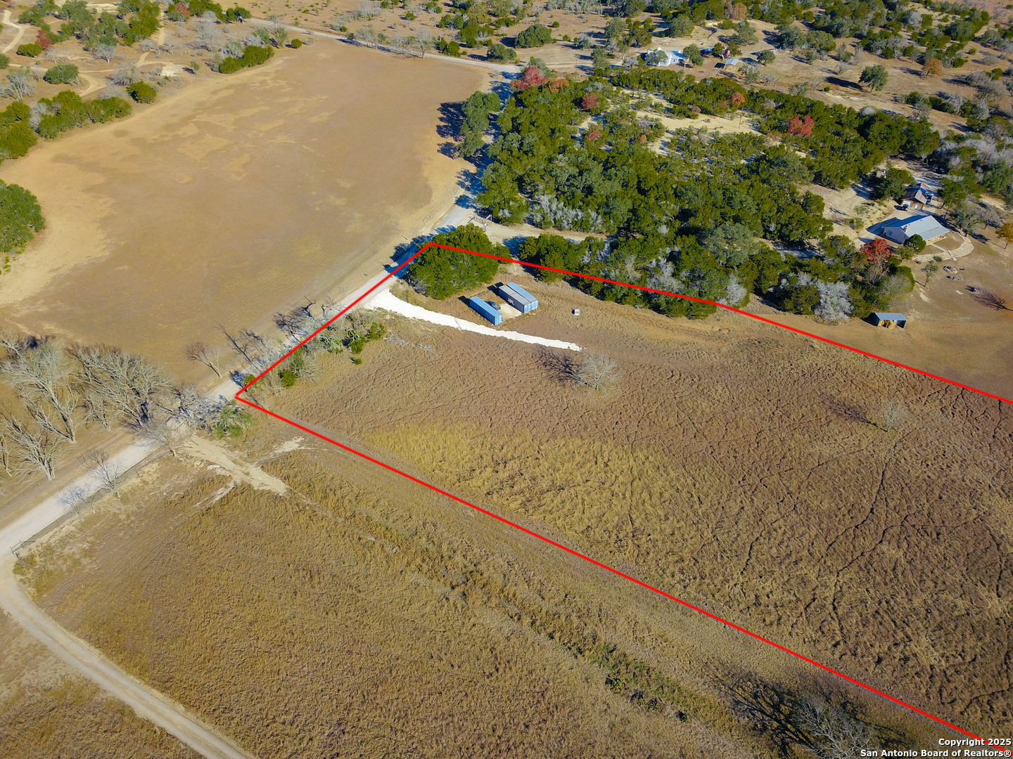 1205 Elm Creek Road Medina, TX 78055 - Photo 2 of 9 a view of a yard with an outdoor space