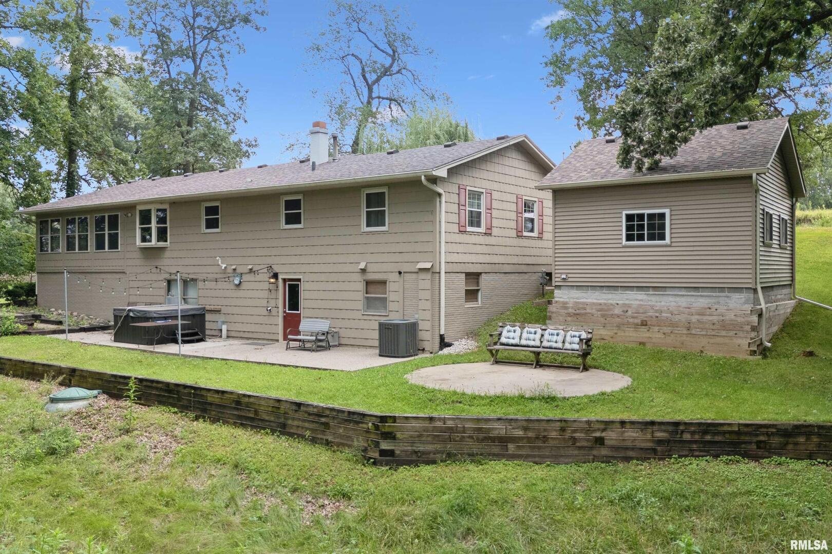 8528 101st Street West Andalusia, IL 61232 - Photo 37 of 42 a front view of a house with garden