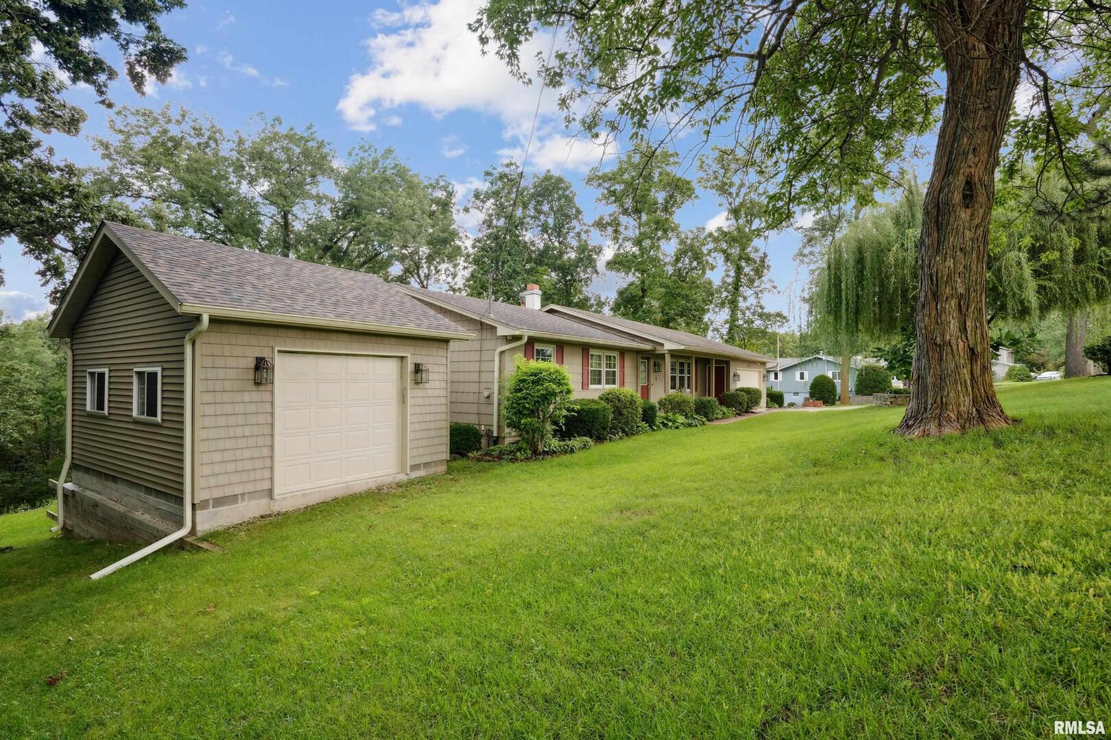 8528 101st Street West Andalusia, IL 61232 - Photo 4 of 42 a front view of house with yard and green space
