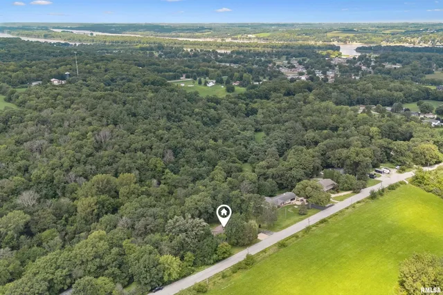 an aerial view of residential house with outdoor space