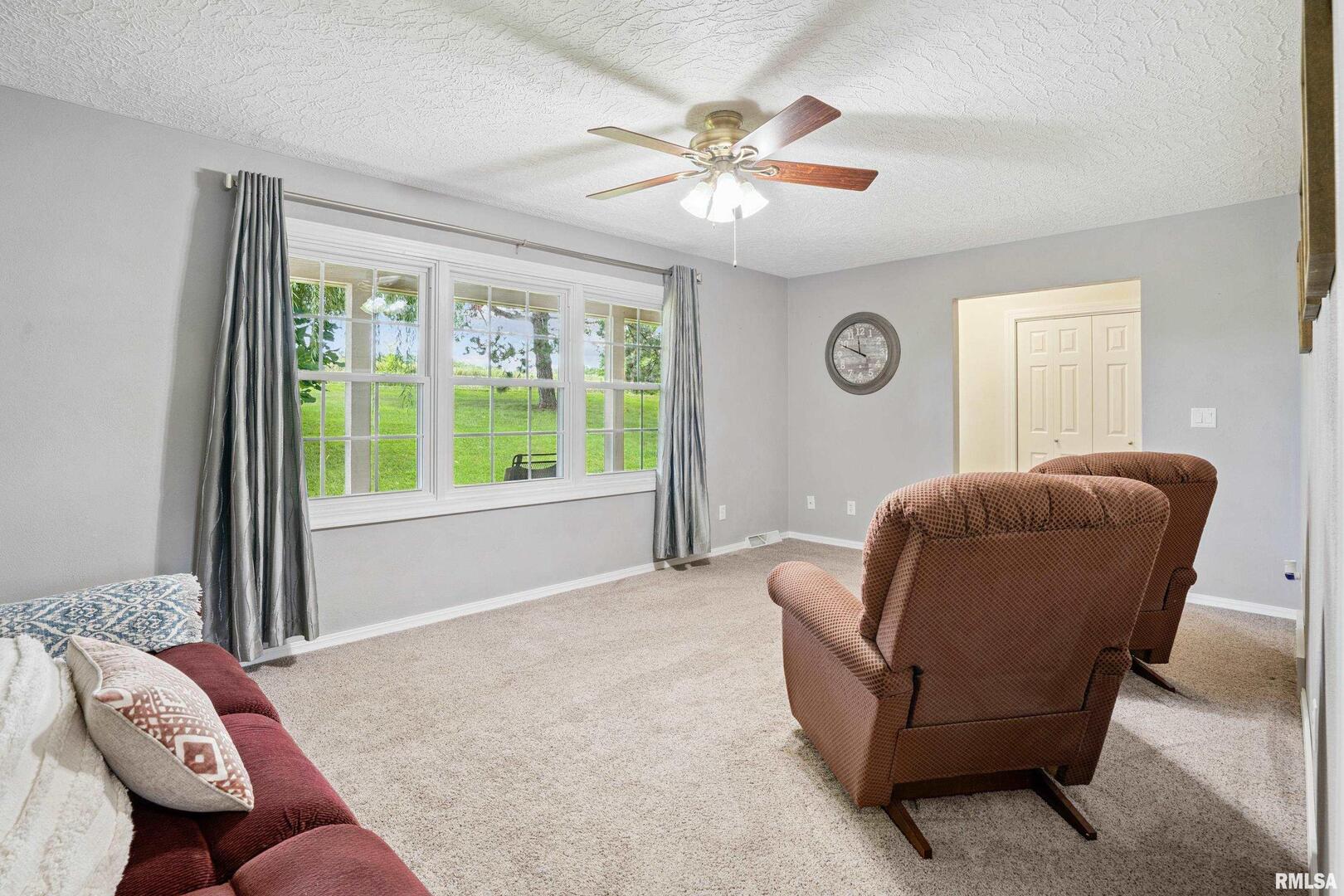 8528 101st Street West Andalusia, IL 61232 - Photo 7 of 42 a living room with furniture and a large window