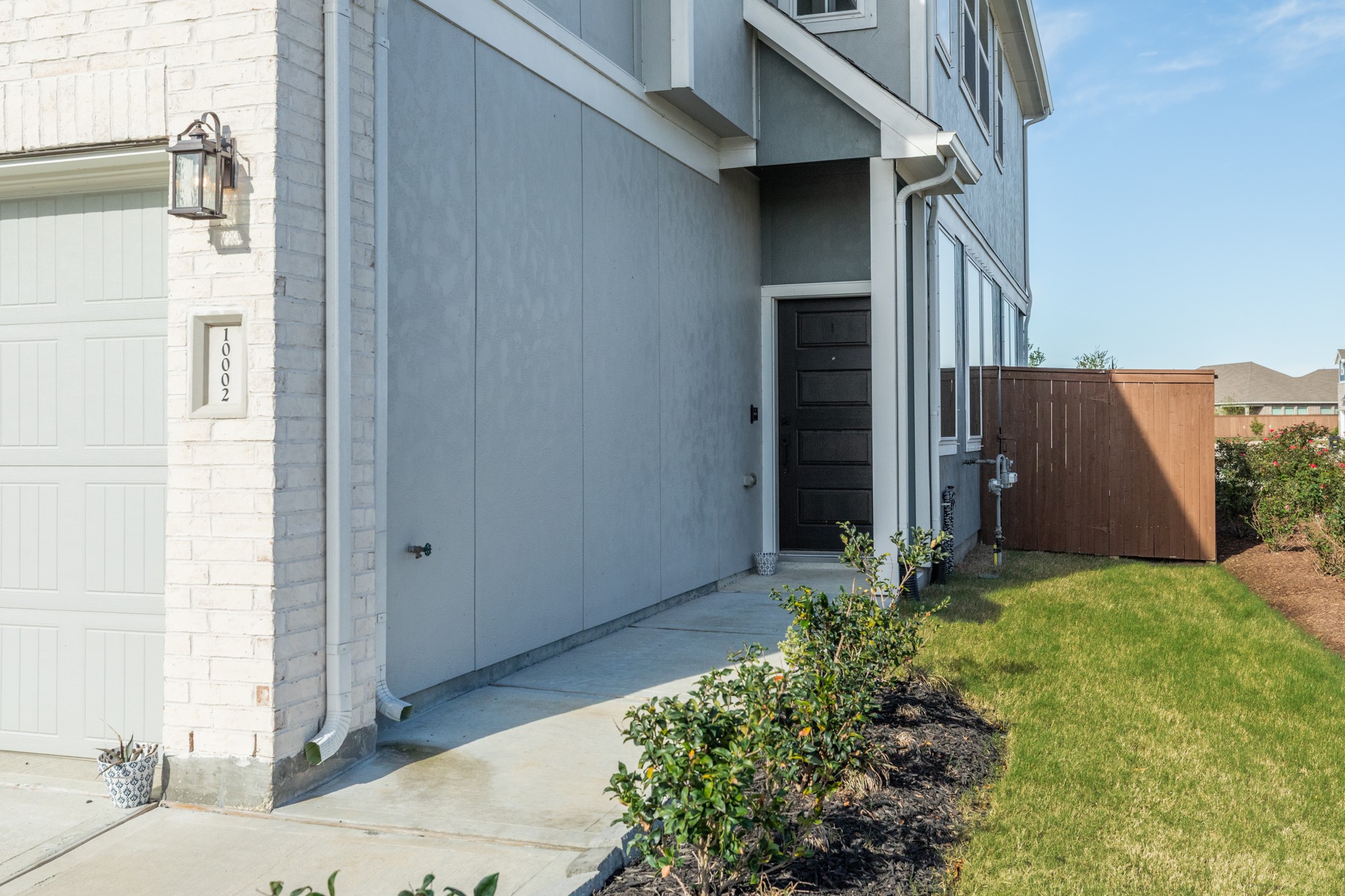 10002 Nectar Path Rosharon, TX 77583 - Photo 3 of 46 Wooden front door situated on the side of the residence.