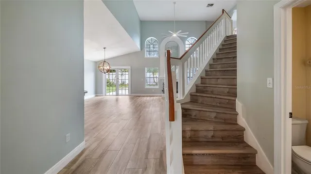 a view of entryway and hall with wooden floor
