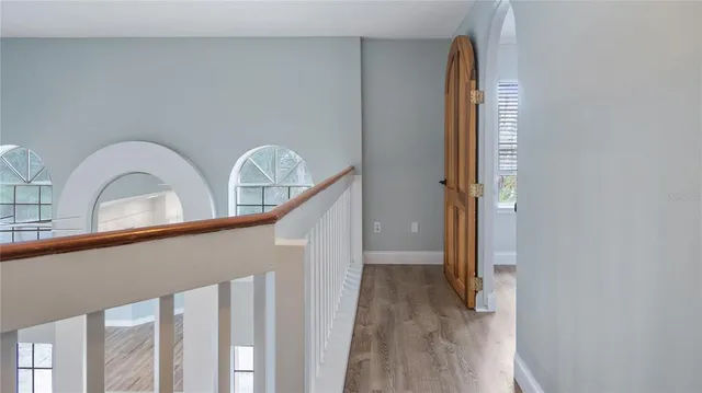 a view of front door with wooden floor