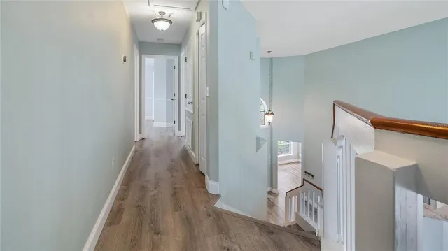 a view of a hallway with a white walls