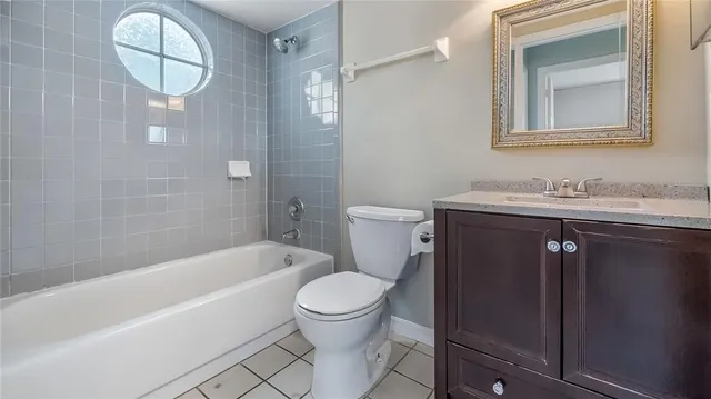 a bathroom with a sink a toilet and bathtub