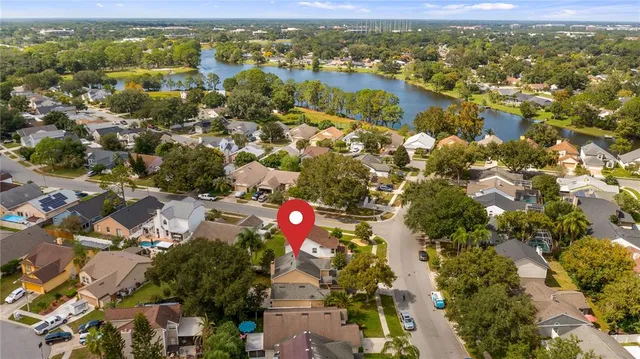 an aerial view of residential houses with outdoor space