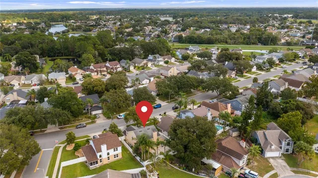 an aerial view of residential houses with outdoor space and river