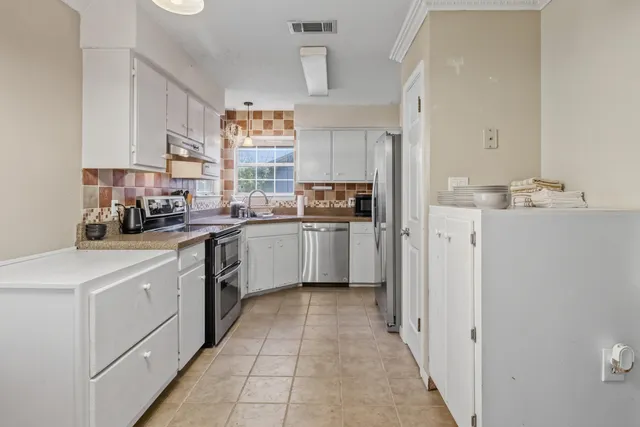 a living room with furniture fireplace and flat screen tv