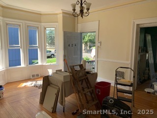 424 Union Avenue, Unit 424 Bridgeport, CT 06607 - Photo 4 of 14 a view of a dining room with furniture and a chandelier