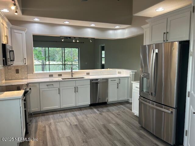 112 Laterra Links Circle, Unit 201 St. Augustine, FL 32092 - Photo 12 of 21 a kitchen with a sink refrigerator and window
