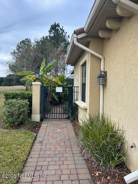 112 Laterra Links Circle, Unit 201 St. Augustine, FL 32092 - Photo 2 of 21 a front view of a house with a yard