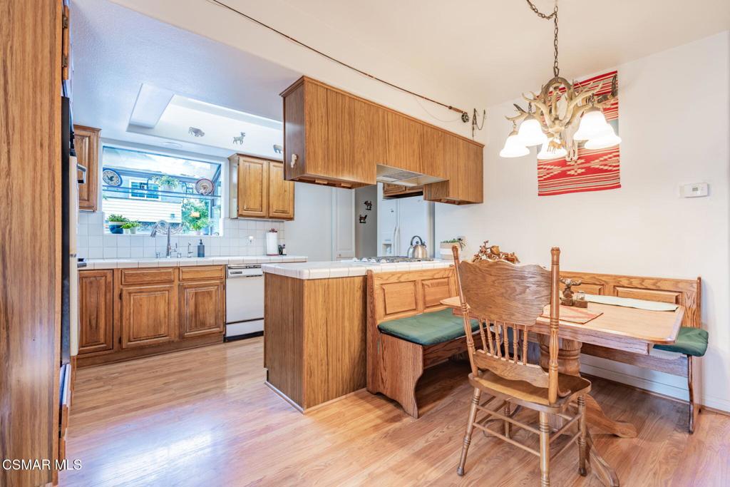 6078 Peppertree Lane Simi Valley, CA 93063 - Photo 16 of 59 a kitchen with a sink cabinets and window