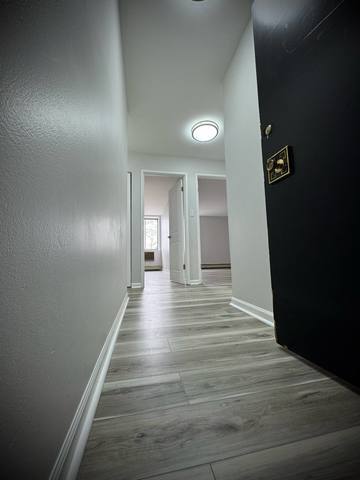 9720 South Pulaski Road, Unit 306 Oak Lawn, IL 60453 - Photo 3 of 12 a view of a hallway with wooden floor
