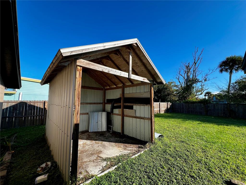 925 Lake Avenue Edgewater, FL 32132 - Photo 15 of 18 a view of a house with backyard and entertaining space