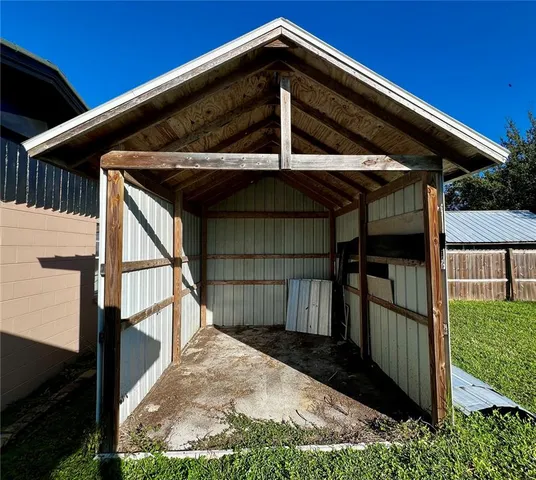a view of a house with a small yard