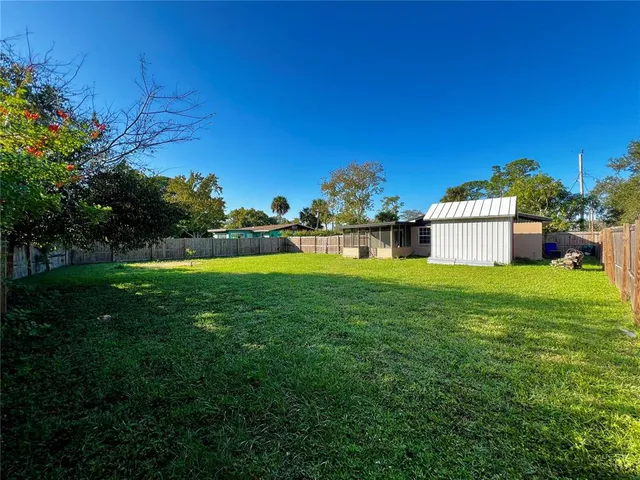 a view of a house with a big yard