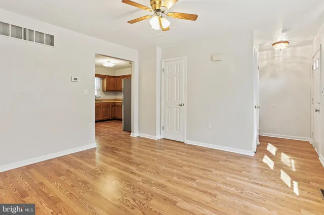 a view of an empty room with a bathroom