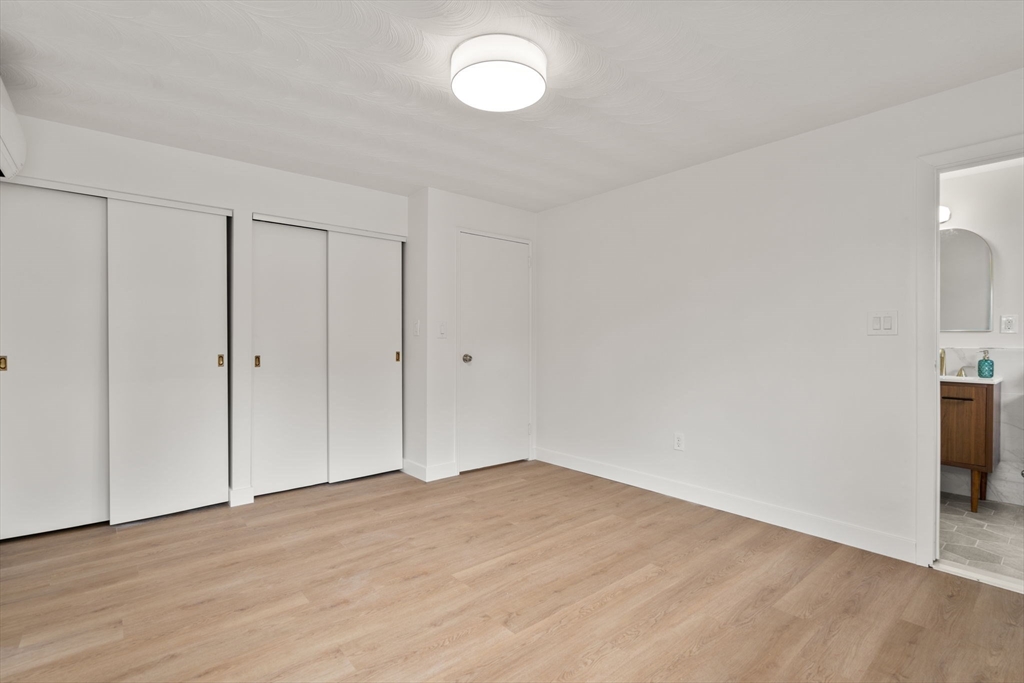8 Clara Road Framingham, MA 01701 - Photo 15 of 41 a view of empty room with wooden floor