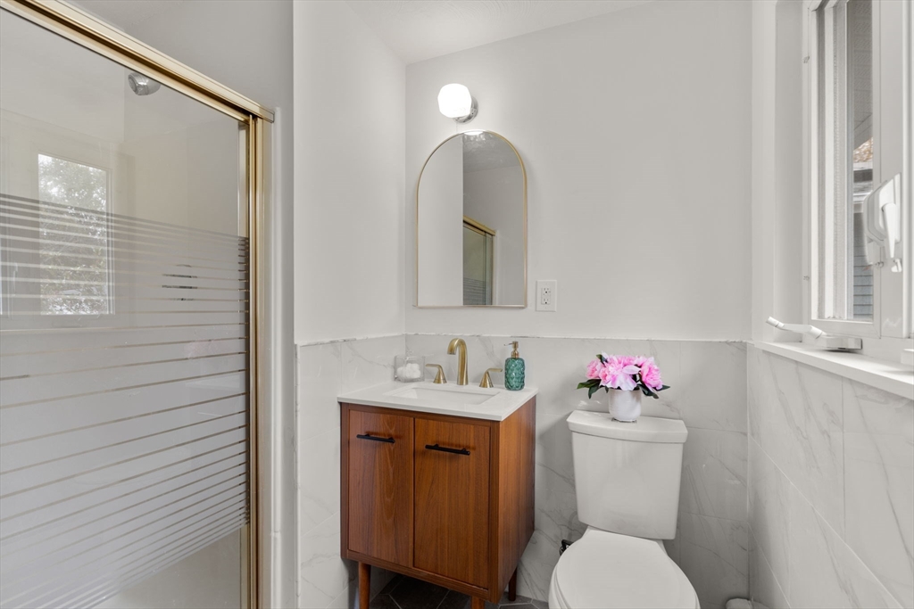 8 Clara Road Framingham, MA 01701 - Photo 16 of 41 a bathroom with a toilet sink and mirror