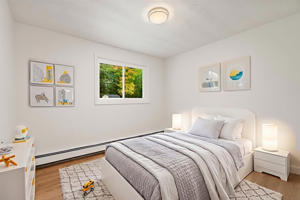 8 Clara Road Framingham, MA 01701 - Photo 18 of 41 a bedroom with a bed and a window
