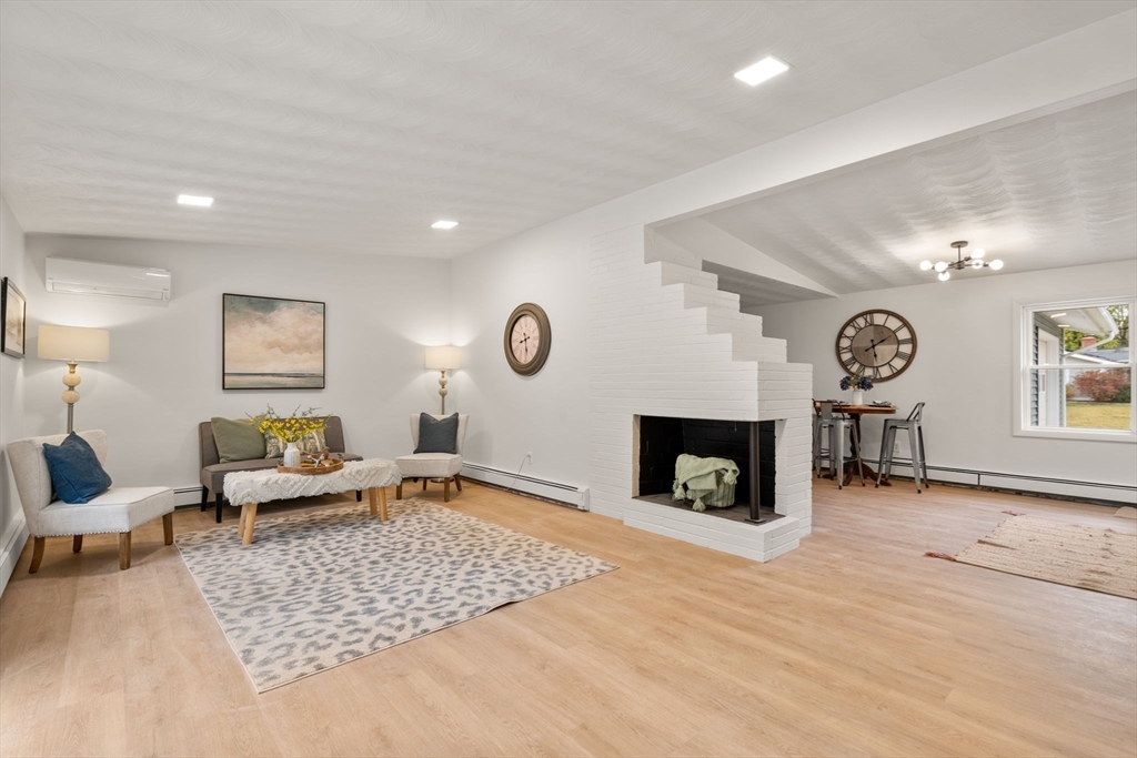 8 Clara Road Framingham, MA 01701 - Photo 4 of 41 a living room with furniture and a fireplace