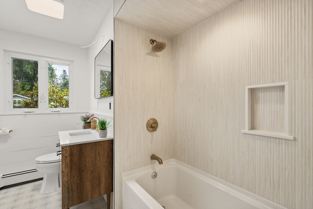 8 Clara Road Framingham, MA 01701 - Photo 41 of 41 a bathroom with a sink and a bathtub