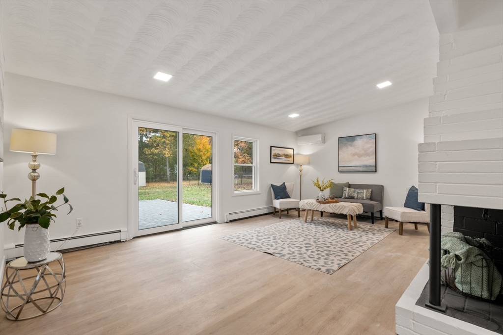 8 Clara Road Framingham, MA 01701 - Photo 7 of 41 a living room with furniture and a potted plant