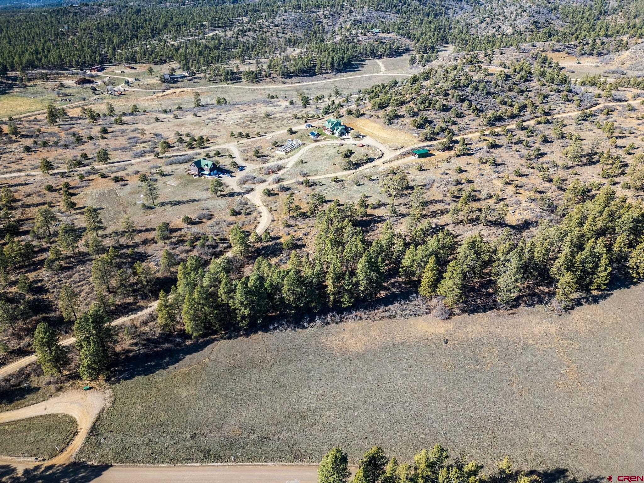 5561 County Road 228 Durango, CO 81301 - Photo 12 of 20 a view of a road with a yard covered with snow