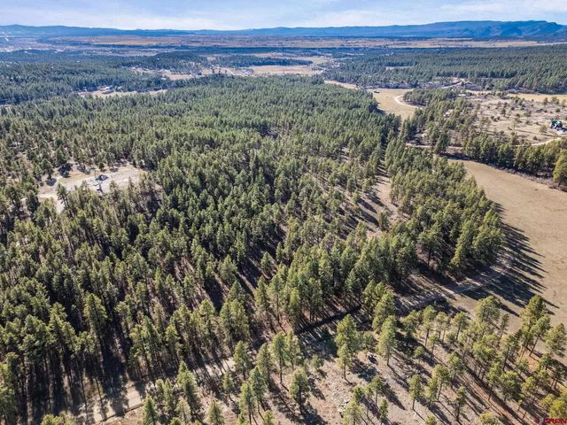 a view of an outdoor space with a lake view and mountain view