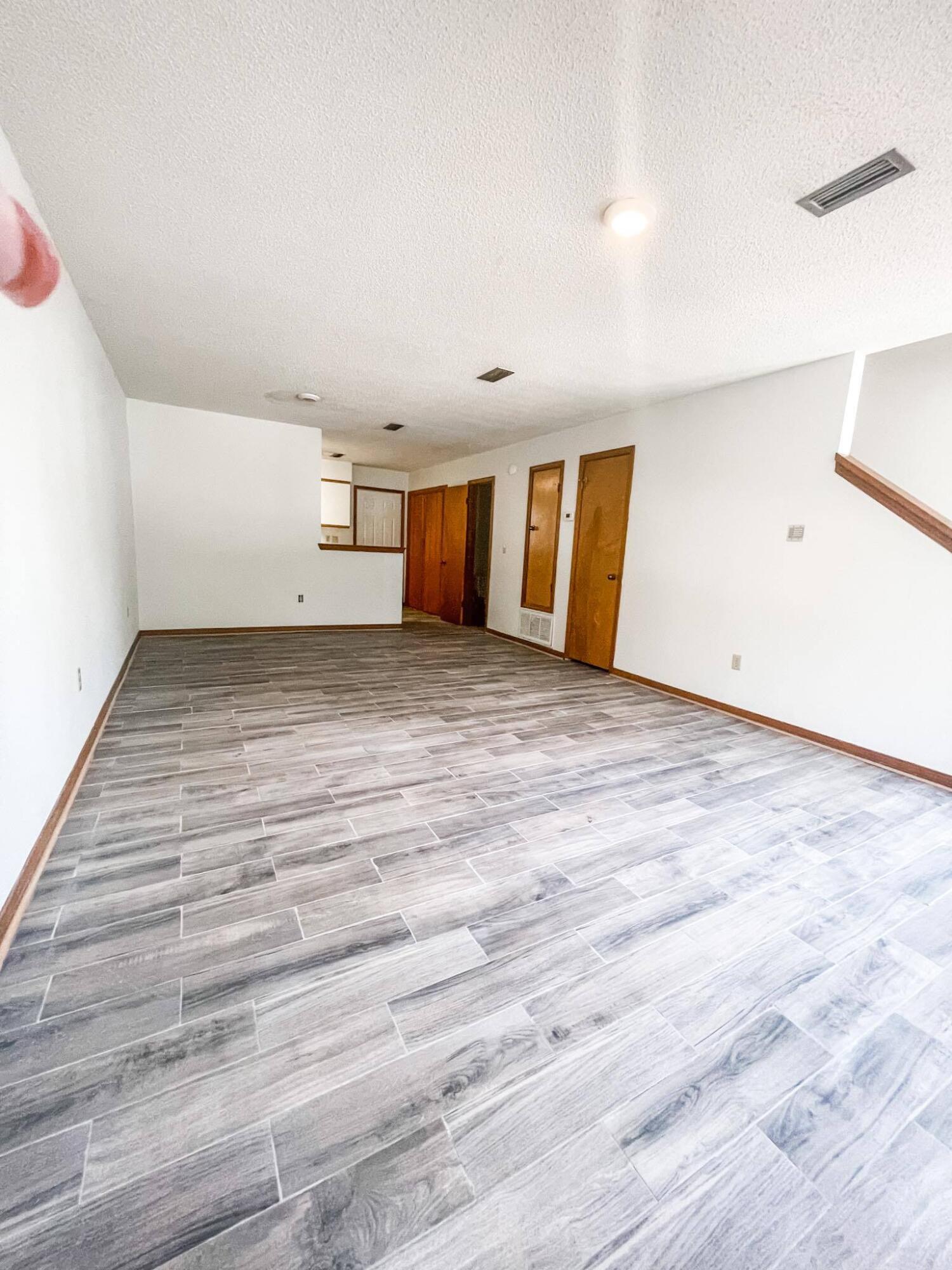 888 Culp Avenue, Unit 3 Fort Walton Beach, FL 32547 - Photo 3 of 12 a view of a livingroom with wooden floor